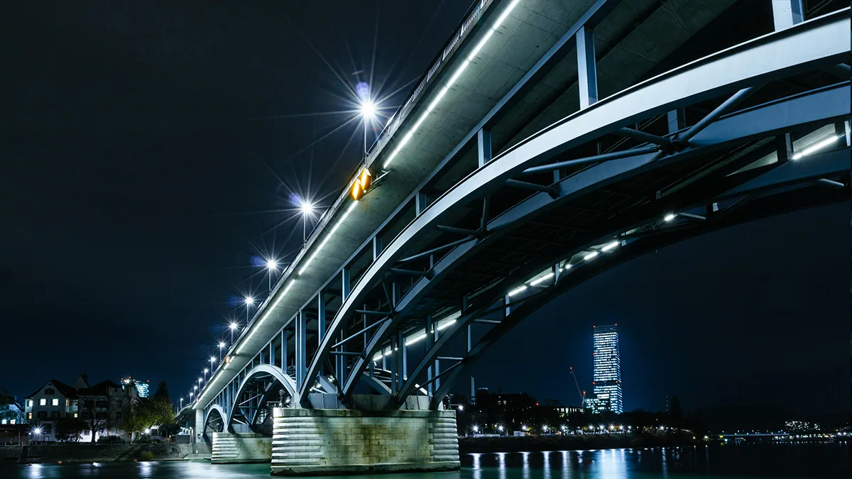 LED flood lights illuminating an industrial facility at night